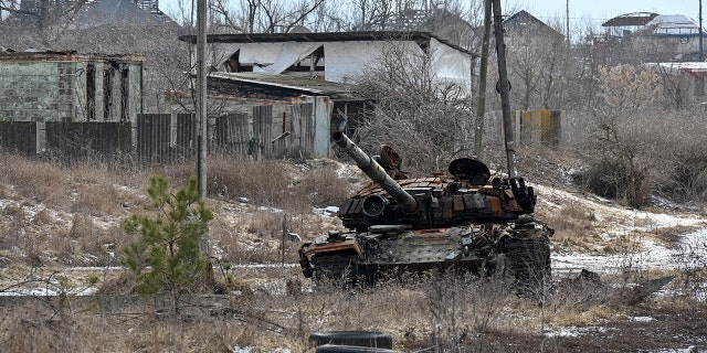 A destroyed tank is photographed in the village of Tsupivka, Kharkiv region, on March 1, 2023, amid the Russian invasion of Ukraine. 