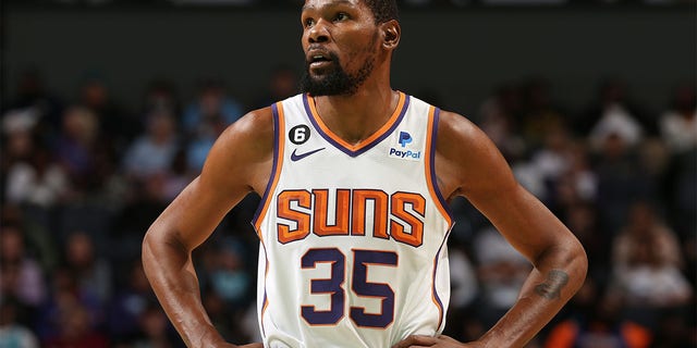 Kevin Durant, #35 of the Phoenix Suns, looks on during the game against the Charlotte Hornets on March 1, 2023 at the Spectrum Center in Charlotte, North Carolina.