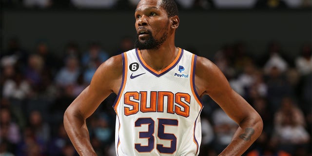 Kevin Durant, #35 of the Phoenix Suns, looks on during the game against the Charlotte Hornets on March 1, 2023 at the Spectrum Center in Charlotte, North Carolina.