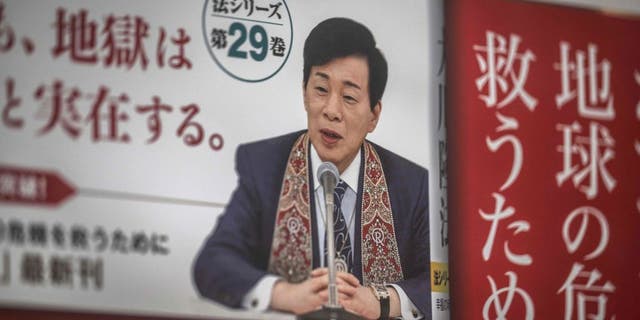 Ryuho Okawa, the leader of the Japanese "Happy Science" religious organization, is seen on an advertisement for his book in front of the spiritual movement's headquarters in Tokyo on March 2, 2023. Okawa died on March 2, 2023 aged 66, local media reported.