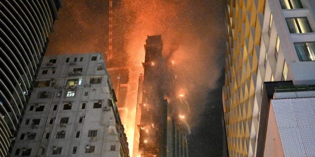 A fire breaks out in a building in Tsim Sha Tsui, in Hong Kong on early March 3, 2023. 