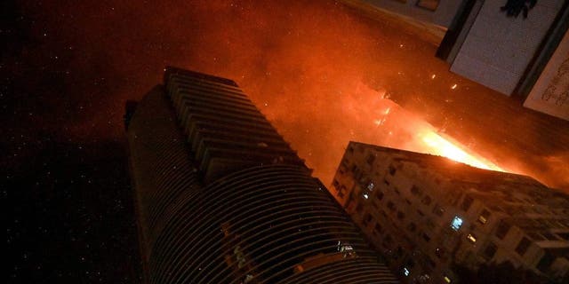 A fire breaks out in an office building in Tsim Sha Tsui, Hong Kong early on March 3, 2023. 