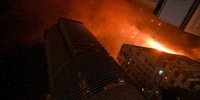 A fire breaks out in an office building in Tsim Sha Tsui, in Hong Kong on early March 3, 2023. 