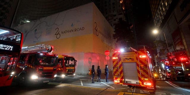 Firefighters respond to a fire that broke out in an office building in Tsim Sha Tsui, Hong Kong early on March 3, 2023. 