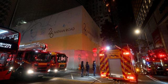 Firefighters respond to a fire breaking out in an office building in Tsim Sha Tsui, in Hong Kong on early March 3, 2023. 