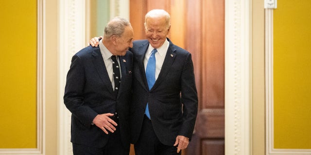 WASHINGTON, DC - MARCH 02: President Joe Biden walks with Senate Majority Leader Chuck Schumer (D-NY) as he arrives at the U.S. Capitol on Thursday.