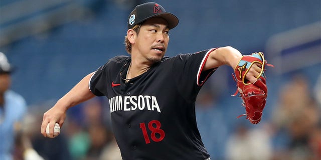 Minnesota Twins Pitcher Kenta Maeda, #18, delivers a pitch to the plate during the MLB spring training game between the Minnesota Twins and the Tampa Bay Rays on March 2, 2023, at Tropicana Field in St. Petersburg, Florida.