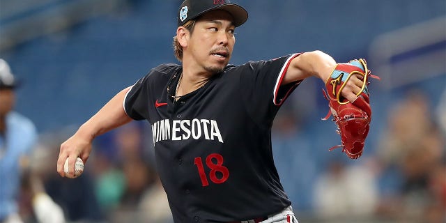 Minnesota Twins pitcher Kenta Maeda, #18, throws a pitch to home plate during the MLB spring training game between the Minnesota Twins and the Tampa Bay Rays on March 2, 2023, at Tropicana Field in St. Petersburg, Florida.