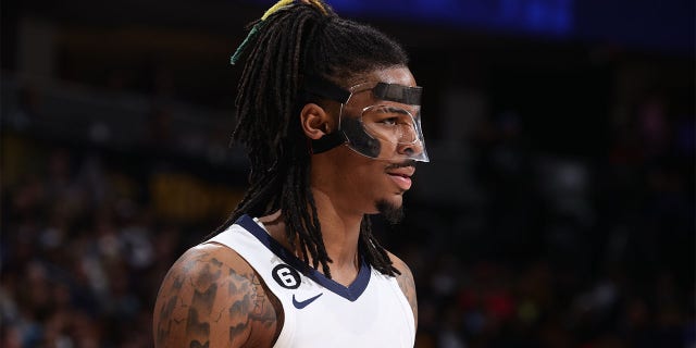 Ja Morant #12 of the Memphis Grizzlies looks on during the game against the Denver Nuggets on March 3, 2023 at Ball Arena in Denver, Colorado. 