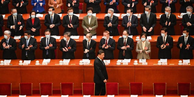 China's President Xi Jinping arrives for the second plenary session of the National People's Congress with other Chinese leaders at the Great Hall of the People in Beijing on March 7, 2023.