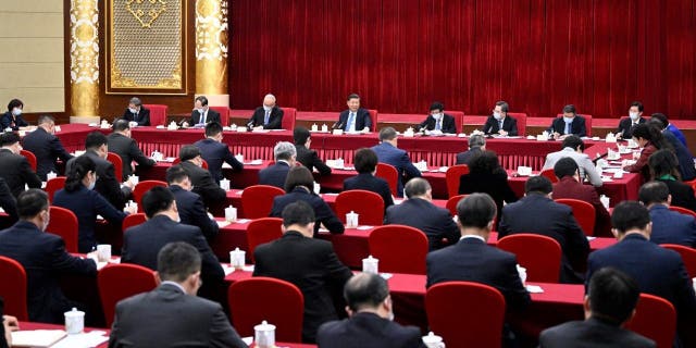 Chinese President Xi Jinping, also general secretary of the Communist Party of China CPC Central Committee and chairman of the Central Military Commission, visits national political advisors from the China National Democratic Construction Association and the All-China Federation of Industry and Commerce, who are attending the first session of the 14th National Committee of the Chinese People's Political Consultative Conference CPPCC, in Beijing March 6, 2023.