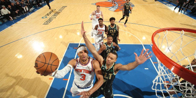 Josh Hart #3 of the New York Knicks drives to the basket during the game against the Charlotte Hornets on March 7, 2023 at Madison Square Garden in New York City, New York.