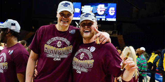 Charleston Cougars forward Ante Brzovic (10) and Charleston Cougars guard Dalton Bolon (3) pose for a photo after the college basketball ACA Conference Tournament championship game between the Wilmington Seahawks of UNC and the Charleston Cougars on March 7, 2023, at the Entertainment & Sports Stadium in Washington DC.