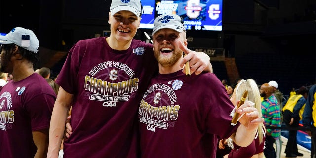 Charleston Cougars Forward Ante Brzovic (10) and Charleston Cougars Guard Dalton Bolon (3) pose for a photo after the College Basketball CAA Conference Tournament Championship Game between the UNC Wilmington Seahawks and the Charleston Cougars on March 7, 2023, at the Entertainment & Sports Arena in Washington DC.