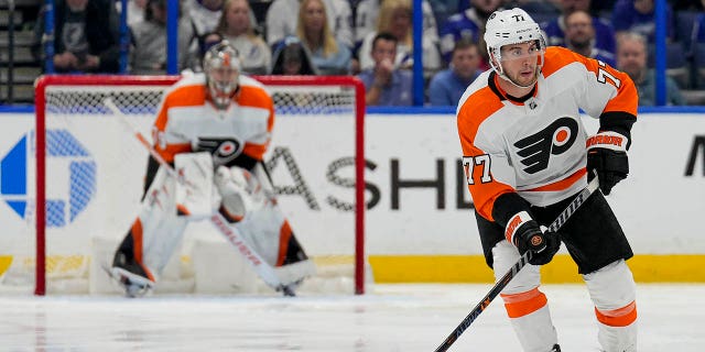 Philadelphia Flyers defenseman Tony DeAngelo, #77, looks to make a pass during the NHL hockey game between the Tampa Bay Lightning and the Philadelphia Flyers on March 7, 2023 at Amalie Arena in Tampa, Florida.