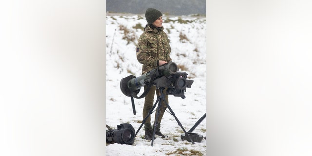 Princess Kate learned about the regiment's weapons systems during her visit with the Irish Guards.