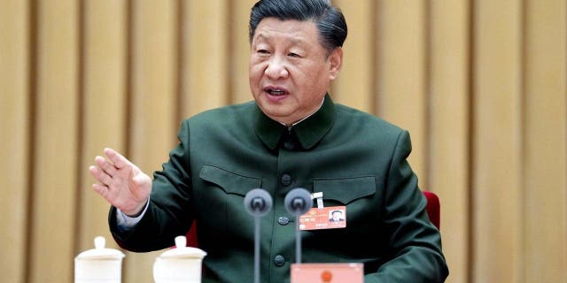 Chinese President Xi Jinping, also general secretary of the Communist Party of China Central Committee and chairman of the Central Military Commission, attends a plenary meeting of the delegation of the People's Liberation Army PLA and the People's Armed Police Force during the first session of the 14th National People's Congress NPC in Beijing March 8, 2023.