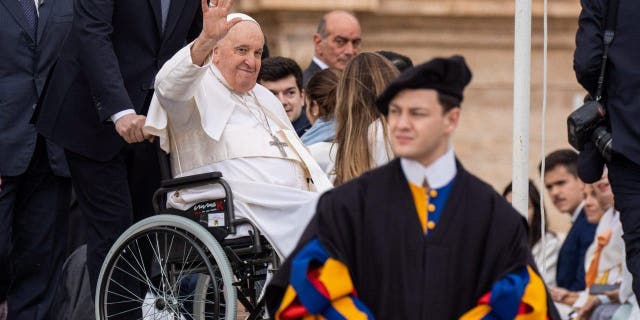 Pope Francis greets and blesses the faithful during the traditional Wednesday General Audience in St. Peter's Square in Vatican City. 