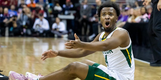 Baylor guard LJ Cryer reacts after losing possession of the ball during the Big 12 Tournament game between the Baylor Bears and the Iowa State Cyclones at the T-Mobile Center in Kansas City, Missouri on Thursday.