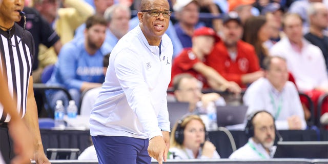 North Carolina Tar Heels head coach Hubert Davis gives instructions to his team during the ACC Tournament against the Virginia Cavaliers on March 9, 2023 at Greensboro Coliseum in Greensboro, North Carolina.