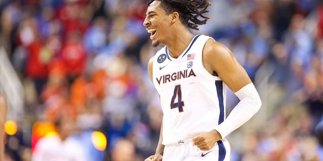 Armaan Franklin, #4 of the Virginia Cavaliers, reacts after making a basket during the ACC Tournament against the North Carolina Tar Heels on March 9, 2023 at Greensboro Coliseum in Greensboro, North Carolina.