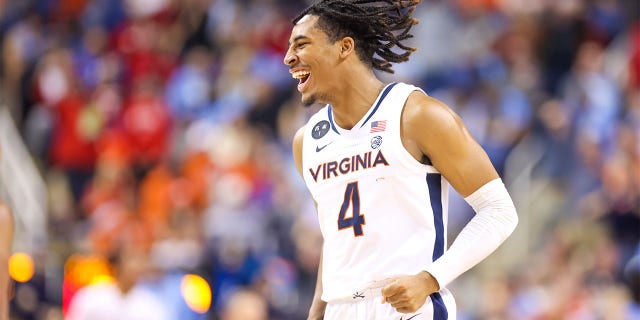 Armaan Franklin, #4 of the Virginia Cavaliers, reacts after making a basket during the ACC Tournament against the North Carolina Tar Heels on March 9, 2023 at Greensboro Coliseum in Greensboro, North Carolina.