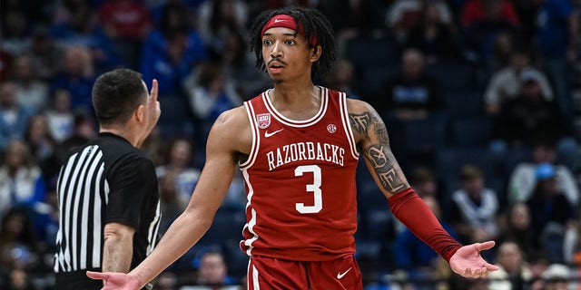 Arkansas Razorbacks guard Nick Smith Jr., #3, reacts to a call during an SEC Men's Basketball Tournament game between the Texas A&M Aggies and the Arkansas Razorbacks on March 10, 2023 in Bridgestone Arena in Nashville, Tennessee.