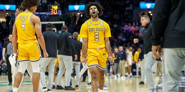 Kent State Golden Flashes guard Sincere Carry (3) celebrates during the first half of the MAC Mens Basketball Tournament Championship game between the Kent State Golden Flashes and Toledo Rockets on March 11, 2023, at Rocket Mortgage FieldHouse in Cleveland, OH.