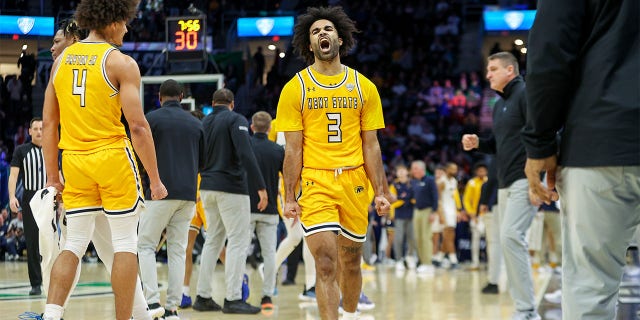 Kent State Golden Flashes guard Sincere Carry (3) celebrates during the first half of the MAC Mens Basketball Tournament championship game between the Kent State Golden Flashes and the Toledo Rockets on March 11, 2023, at Rocket Mortgage FieldHouse in Cleveland, OH .