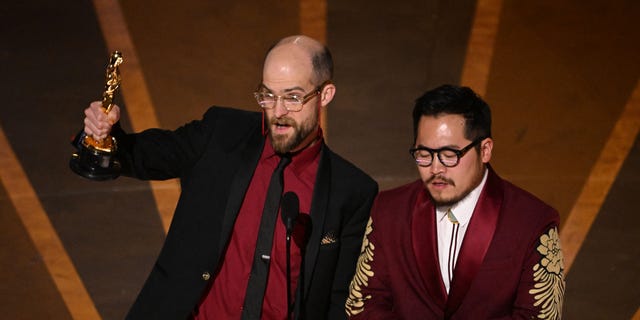 US director Daniel Scheinert (L) and US director Daniel Kwan accepts the Oscar for Best Director for "Everything Everywhere All at Once" onstage during the 95th Annual Academy Awards at the Dolby Theatre in Hollywood, California on March 12, 2023.