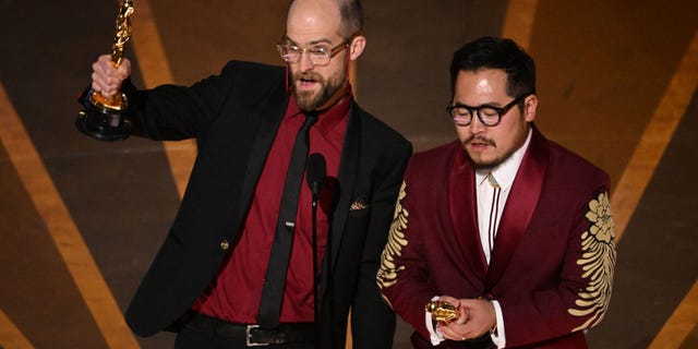 US director Daniel Scheinert (L) and US director Daniel Kwan accepts the Oscar for Best Director for "Everything Everywhere All at Once" onstage during the 95th Annual Academy Awards at the Dolby Theatre in Hollywood, California on March 12, 2023.