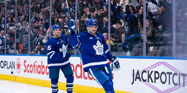 Auston Matthews, right, of the Toronto Maple Leafs celebrates a goal against the Buffalo Sabres at Scotiabank Arena March 13, 2023, in Toronto. 
