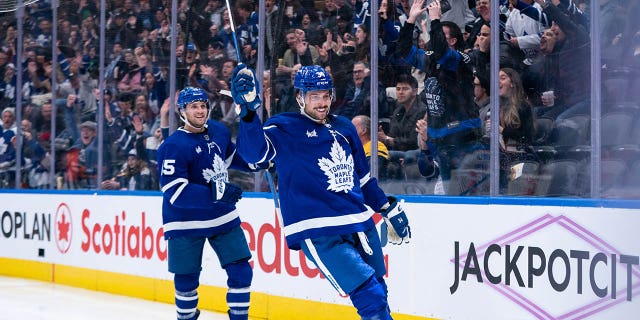 Auston Matthews, right, of the Toronto Maple Leafs celebrates a goal against the Buffalo Sabers at Scotiabank Arena on March 13, 2023 in Toronto.