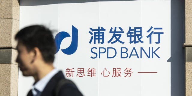 Signage at a Shanghai Pudong Development Bank Co. branch in Shanghai, China, on Tuesday, March 14, 2023. Shanghai Pudong said its joint venture in China with Silicon Valley Bank isn't affected by the turmoil surrounding the US lender, and urged clients to stay calm.