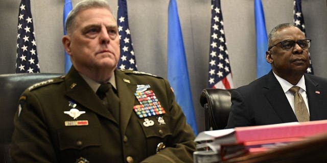 Secretary of Defense Lloyd Austin, right, and Joint Chiefs of Staff Chairman General Mark Milley attend a virtual meeting of the Ukraine Defense Contact Group at the Pentagon March 15, 2023 in Washington, DC