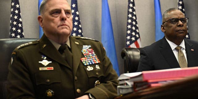 Defense Secretary Lloyd Austin, right, and Chairman of the Joint Chiefs of Staff General Mark Milley attend a virtual meeting of the Ukraine Defense Contact Group on March 15, 2023, at the Pentagon in Washington, D.C.