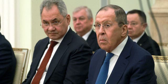 Russian Defense Minister Sergei Shoigu, left, and Foreign Minister Sergei Lavrov attend a meeting of Russian President Vladimir Putin with his Syrian counterpart Bashar al-Assad at the Moscow Kremlin March 15, 2023. 