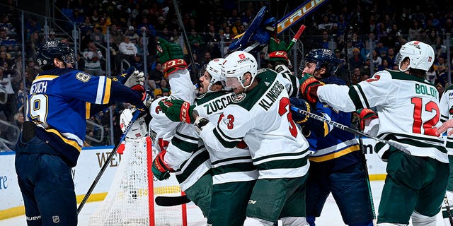 Jordan Binnington, #50 of the St. Louis Blues, gets physical with the Minnesota Wild at the Enterprise Center on March 15, 2023, in St. Louis, Missouri. 