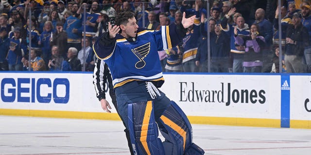 Jordan Pennington, #50 of the St. Louis Blues, gets the crowd pumping during the game against the Minnesota Wild at Enterprise Center on March 15, 2023, in St. Louis, Missouri.