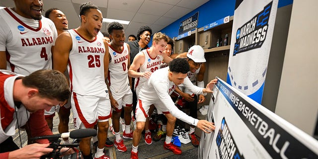 The Alabama Crimson Tides celebrate and moves their name to the second round after the win against Texas A&M-Corpus Christi Islanders during the first round of the 2023 NCAA Men's Basketball Tournament held at Legacy Arena at the BJCC on March 16, 2023 in Birmingham, Alabama.
