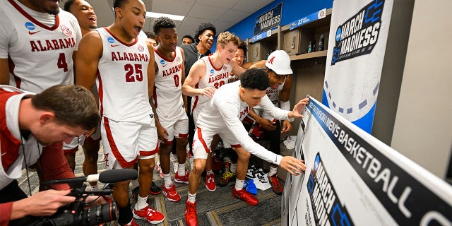 The Alabama Crimson Tides celebrate and moves their name to the second round after the win against Texas A&M-Corpus Christi Islanders during the first round of the 2023 NCAA Men's Basketball Tournament held at Legacy Arena at the BJCC on March 16, 2023 in Birmingham, Alabama.