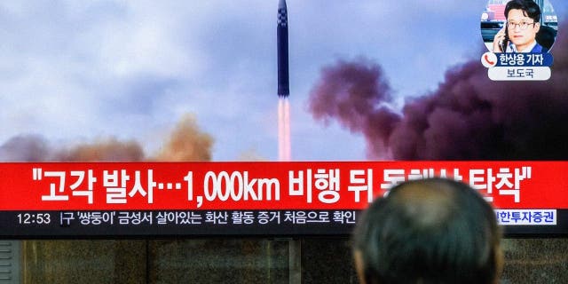 A TV screen at Yongsan railway station shows a news bulletin about one of North Korea's recent long-range ballistic missile launches.