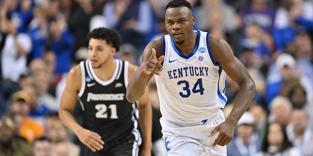 Oscar Tshiebwe (34) of the Kentucky Wildcats moves down the court during a game against the Providence Friars during the first round of the 2023 NCAA Tournament at Greensboro Coliseum March 17, 2023, in Greensboro, N.C.