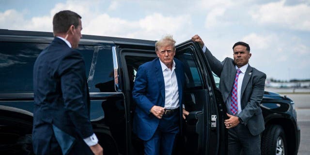 Former President Donald Trump boards his airplane, known as Trump Force One, in route to Iowa at Palm Beach International Airport on Monday, March 13, 2023, in West Palm Beach, FL. 