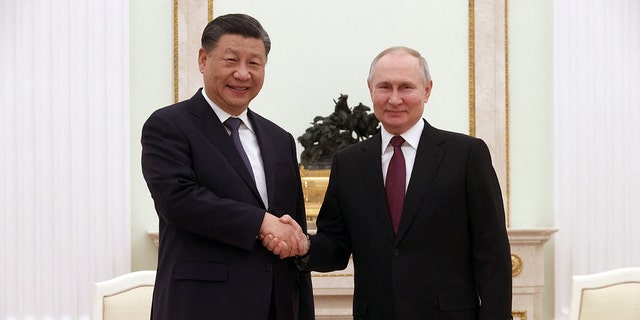 Russian President Vladimir Putin, right, meets with China's President Xi Jinping at the Kremlin in Moscow on March 20, 2023.