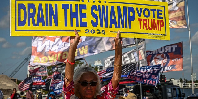 Libby Depiero, a supporter of former President Trump, protests near the Mar-a-Lago Club in Palm Beach, Fla., March 21, 2023. 