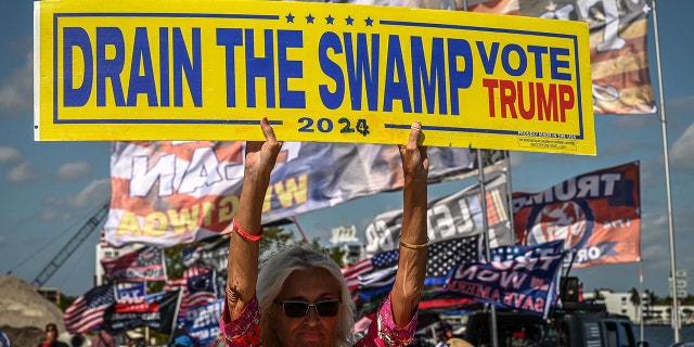 Libby Depiero, a supporter of former President Trump, protests near the Mar-a-Lago Club in Palm Beach, Fla., March 21, 2023. 