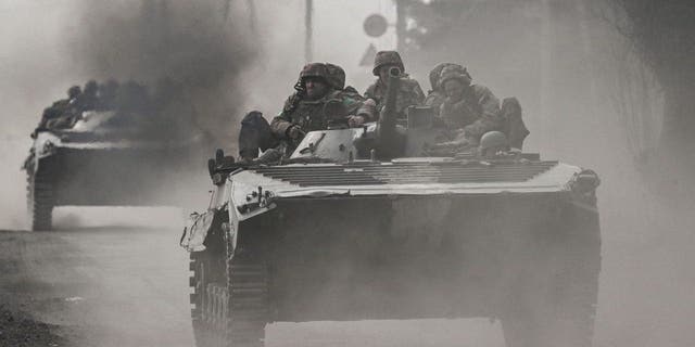 Ukrainian servicemen head toward Bakhmut in BMP infantry fighting vehicles in eastern Ukraine.
