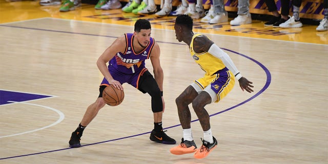 Devin Booker of the Phoenix Suns dribbles the ball against the Lakers on March 22, 2023, at Crypto.Com Arena in Los Angeles.
