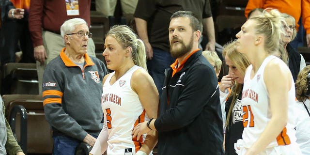 Bowling Green Falcons guard Elissa Brett (5), left, is assisted off the court after an altercation with Memphis Tigers guard Jamirah Shutes (not pictured) during the handshake Post-game following a third-round game at the Women's National Invitational Tournament on March 23, 2019. 2023, at the Stroh Center in Bowling Green, Ohio.  